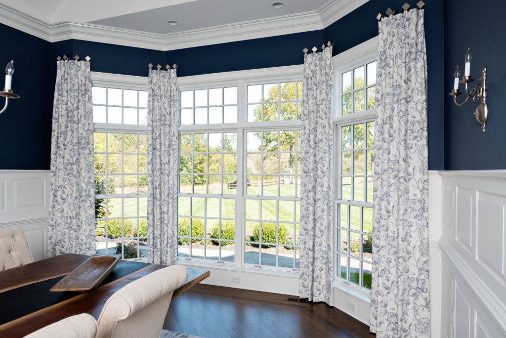 Make your windows look larger and brand new with updated drapery