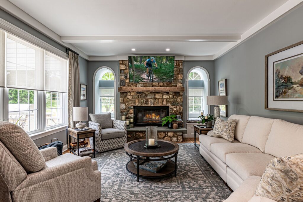 transitional family room with brick fireplace